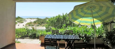 Plant, Property, Furniture, Table, Sky, Green, Building, Flowerpot, Shade, Umbrella