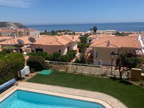Sea view from the veranda overlooking the pool & garden