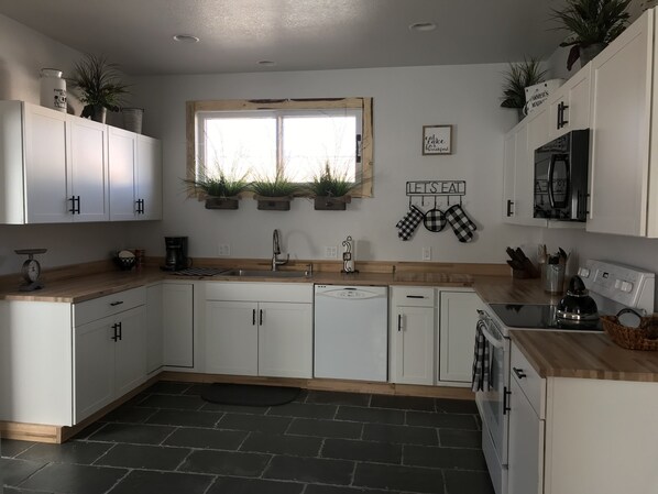 Large fully equipped kitchen.  Everything you need to cook a home cooked meal. 