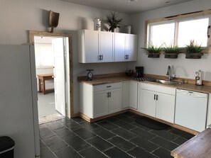 Large laundry room is located off the kitchen.