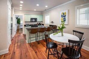 Dining area for four with additional bar seating