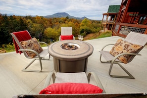 Firepit with breathtaking view on lower patio, close to 6 person hot tub.
