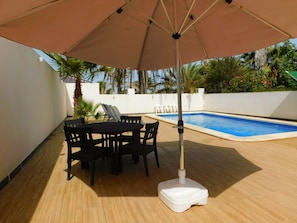 Outside seating by the pool (2 tables and 8 chairs ) plus additional seating 