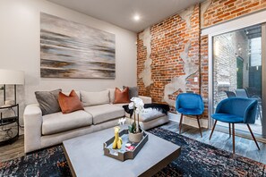 Open concept living, kitchen, and dining area with ample comfortable seating options for you and your guests.