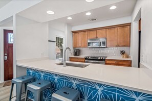 Full kitchen with stainless steel appliances