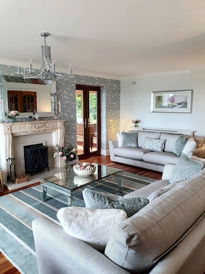 Living room with log burner and comfortable sofas