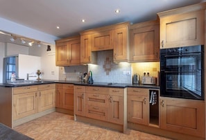 Large well-equipped kitchen with two separate breakfast bars.