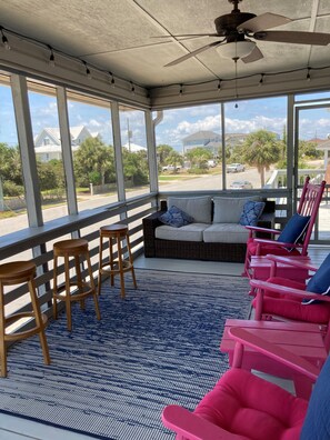 Back Screened porch with bar seating and comfy outdoor couch