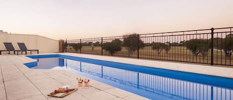 Take a refreshing dip in the sparkling pool while soaking in uninterrupted views of the golf course.