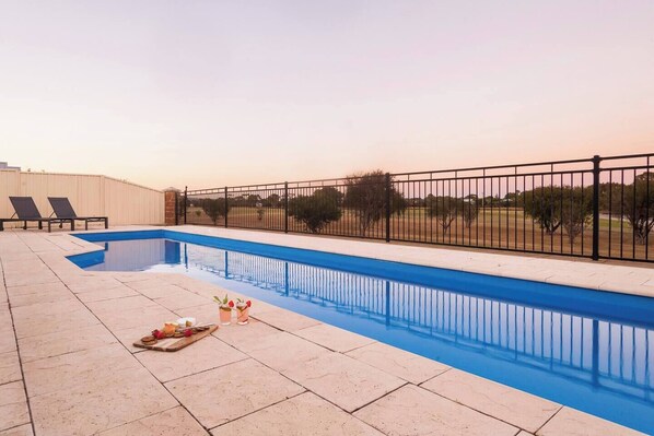 Take a refreshing dip in the sparkling pool while soaking in uninterrupted views of the golf course. 