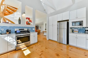 Kitchen with appliances you need to prepare and store food.