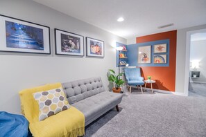 Basement counts with a second 55in Smart Tv, Foosball table and Arcade console
