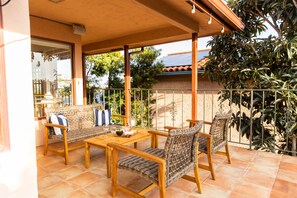 Enjoy wine and snacks at a golden hour from the second-floor balcony.