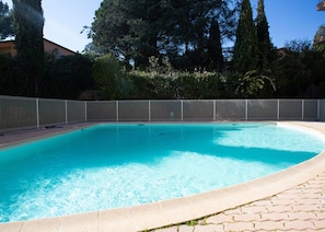 Communal pool with sun loungers.
Beach towels available in the apartment