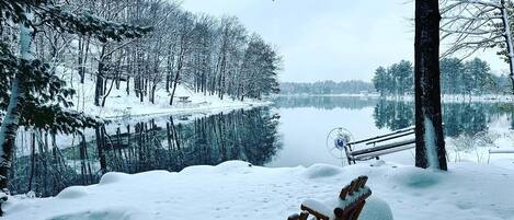 Step off the front porch & enjoy the snowy, lake view while roasting s’mores 🔥