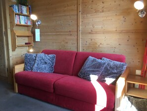 Sofa in lounge area that folds out to make King size bed