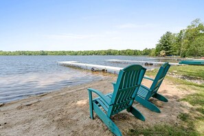 Adirondack chairs and private dock on private beach, located 1 mile from Woodland Pines Cottage