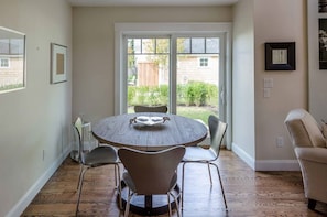 Dining Area Has Sliding Door To Brick Patio