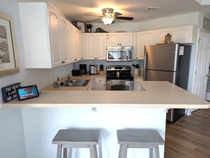 Kitchen with Breakfast Counter at 1103 SeaCrest