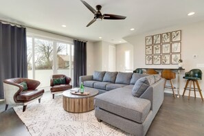 The living area walks out to a balcony overlooking downtown