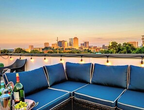 Enjoy evening sunsets on the rooftop deck boasting one of the highest points in the neighborhood!