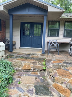 Back door path that leads into Den and Den Bathroom.  
Propane Grill on porch.