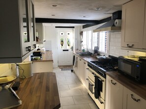 Fully equipped kitchen with store cupboard essentials - herbs, oils, sauces, etc