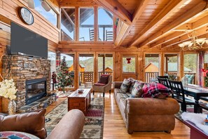 Living room with high glass windows and Queen Sleeper Sofa