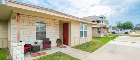 A cozy front porch to welcome friends and plenty of parking plus an RV plug!