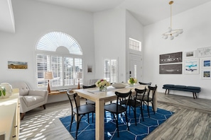 Sun-drenched dining room for eight with nooks perfect for reading and enjoying the sunlight that pours in throughout the day