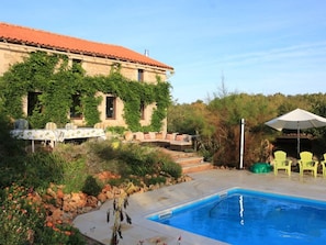 View of terraces from Pergola seating which has natural vegitation/floral cover