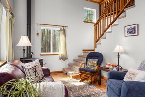 Living Area with stairs to upper loft bedroom