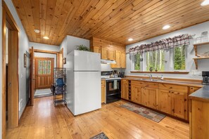 Kitchen area with entrance to lower bedroom, bathroom and laundry