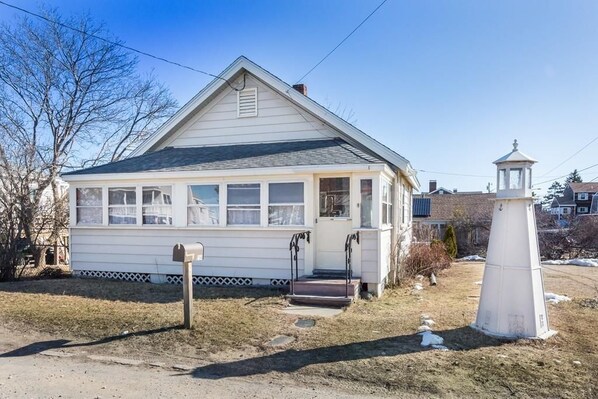 Front of cottage. Street view on Northern Boulevard.