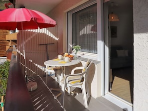 Table, Plant, Building, Furniture, Umbrella, Flowerpot, Chair, Interior Design, Outdoor Furniture, Porch