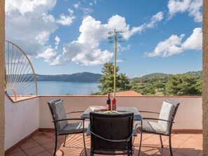 Cloud, Sky, Property, Furniture, Water, Table, Azure, Plant, Chair, Shade