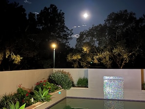 Full moon rising over the pool
