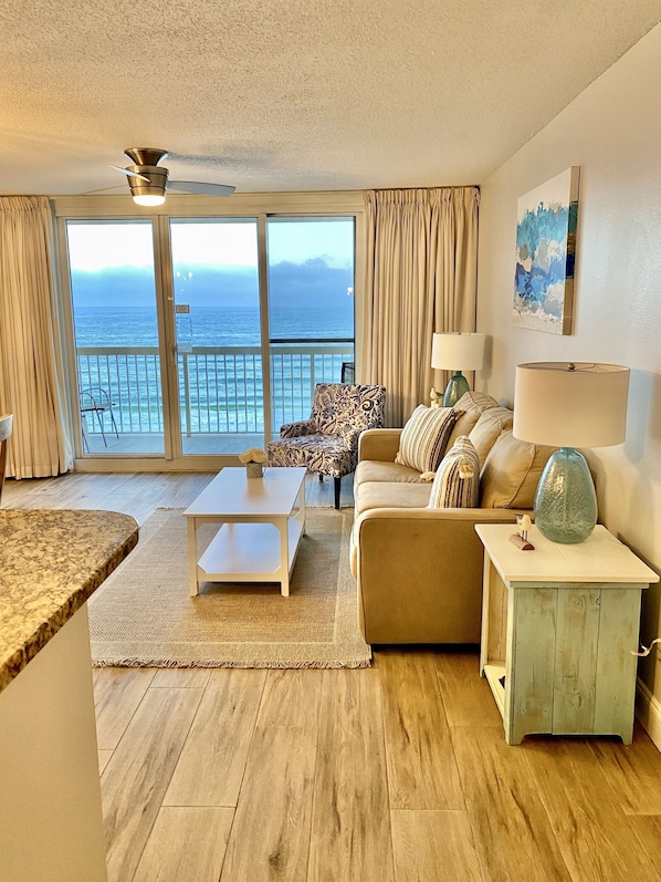 Spacious living room with a large private balcony overlooking the gorgeous Sea.