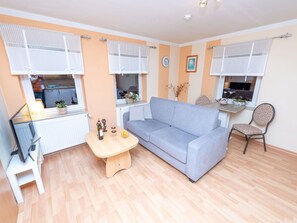 Couch, Furniture, Azure, Picture Frame, Living Room, Interior Design, Architecture, Table, Houseplant, Studio Couch