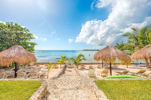 La Iguana oceanfront with palapas and loungers - La Iguana condo 7, 1 Bedroom, Akumal Mexico vacation rental