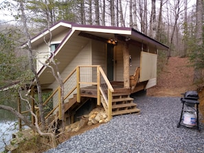 notice the covered stairs going downstairs to the laundry room and swing porch.