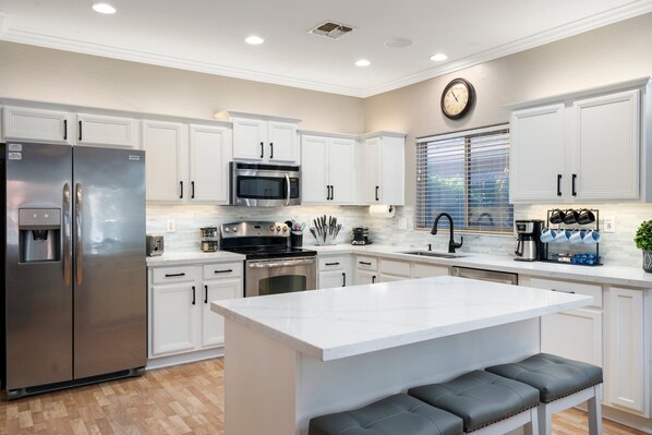 Newly renovated modern kitchen, stocked with basic cooking supplies