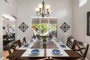Formal dining area seats 8 people comfortably
