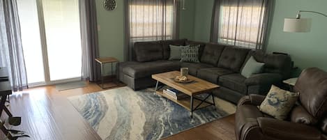 Comfy family room with a 70" smart tv.
