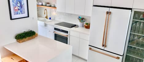 Cook in this beautiful kitchen while looking at the ocean a few steps away!