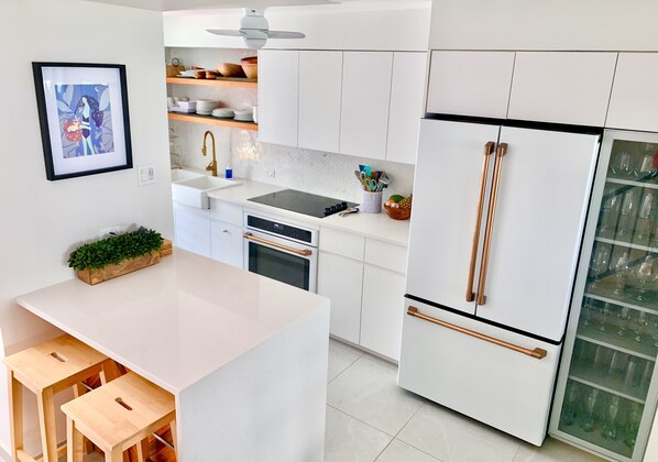 Cook in this beautiful kitchen while looking at the ocean a few steps away!