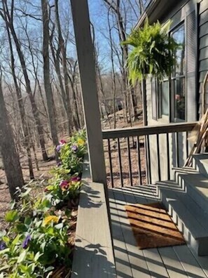 Front porch view with a rocking chair.