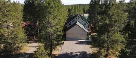 Front view from the driveway. Reservoir in background, September 2022, lower fall level.