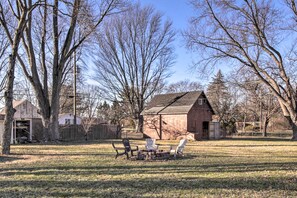 The house features a big yard with a fire pit for evening marshmallow roasts!