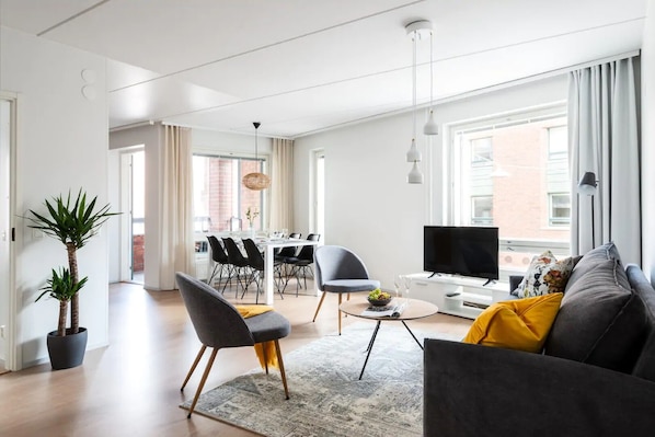 Beautiful open plan living room with a dining area and kitchen.